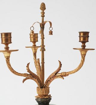 A pair of  Louis XVI-style late 19th century three-light candelabra.