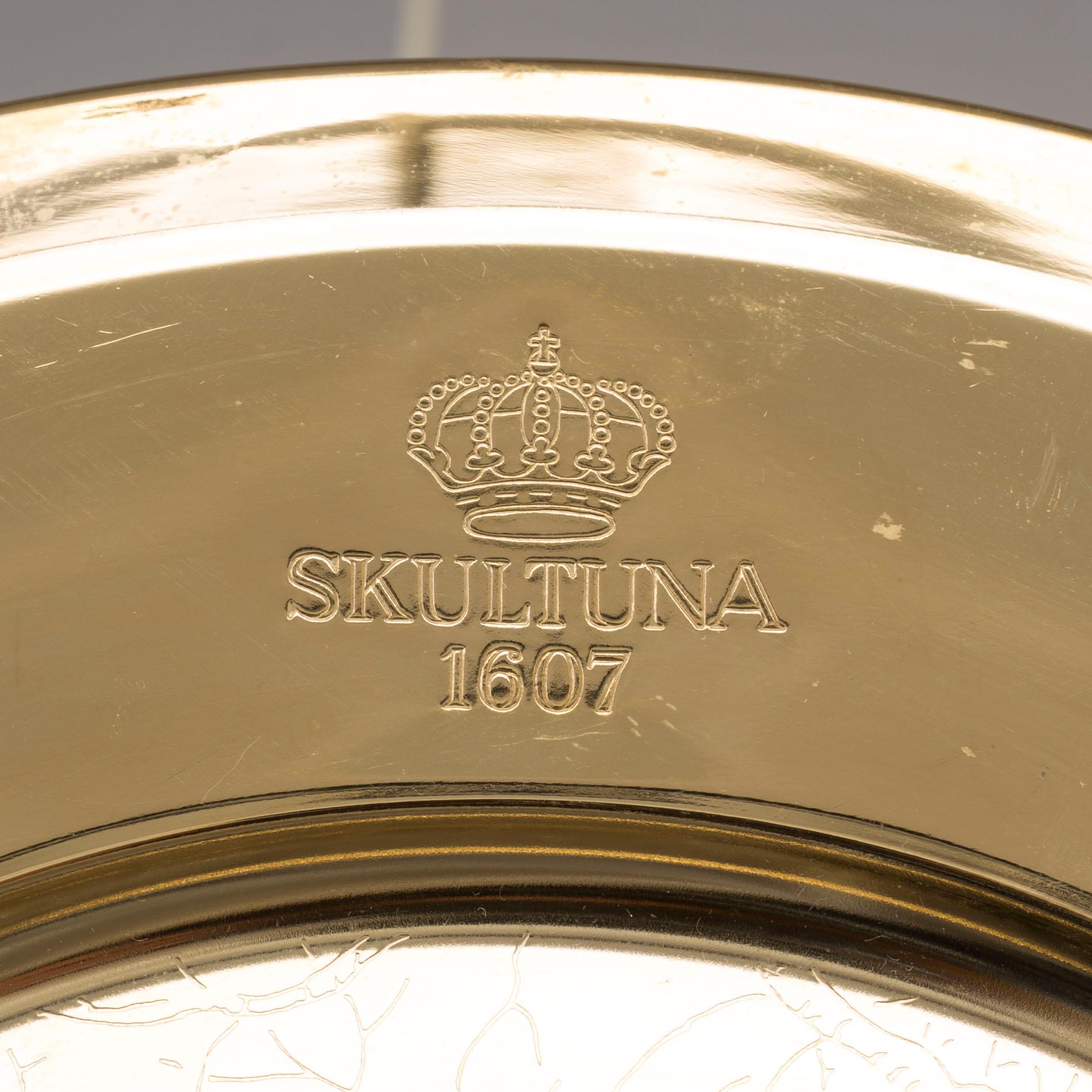 12 brass plates from Skultuna, late 20th century.