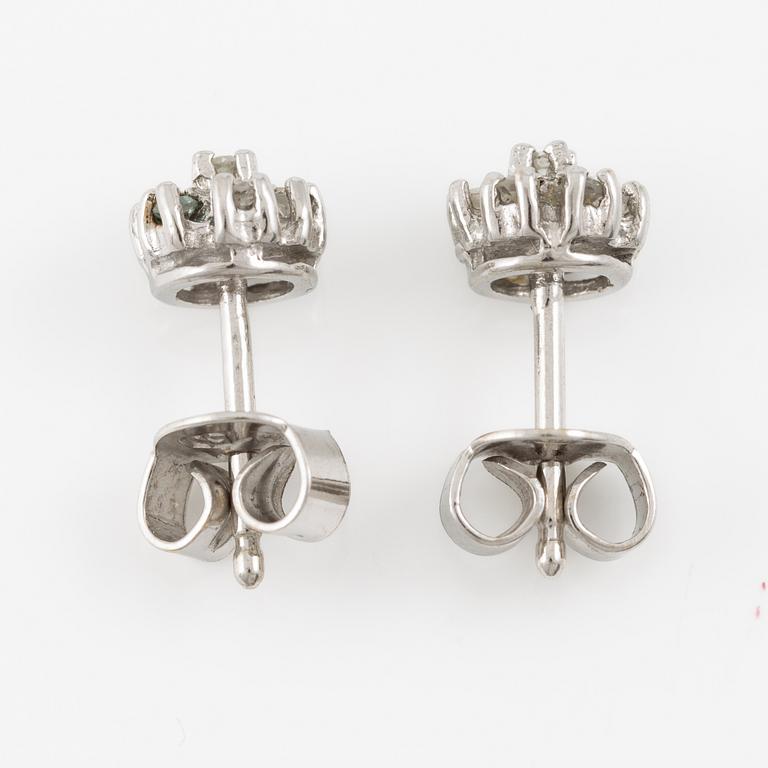 A ring and a pair of earrings in 18K white gold set with round brilliant-cut and octagonal-cut diamonds.