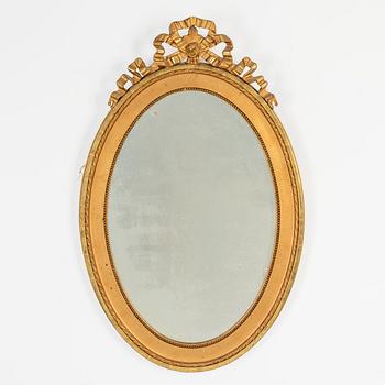 An oval Gustavian style mirror, early 20th Century.