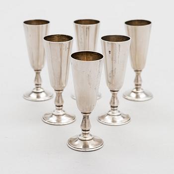 A set of six silver vodka cups, maker's mark of Vasily Kangin, Saint Petersburg, 1898-1903.