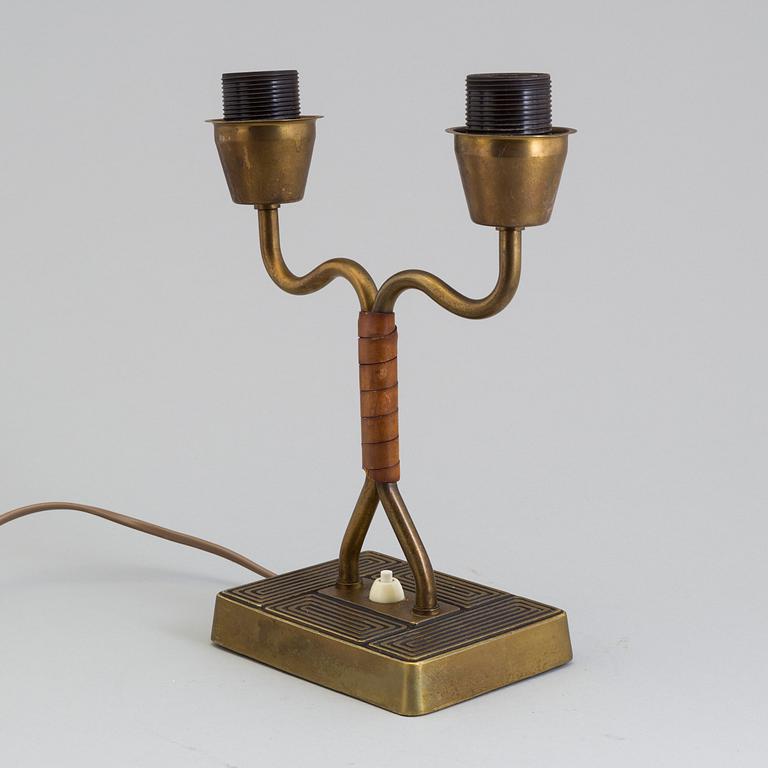 A 1940s Sonja Katzin brass table light from Asea.