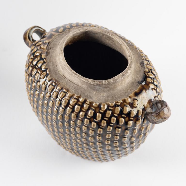 A green glazed jar and an olive glazed pot with handles, Qing dynasty, 19th Century.