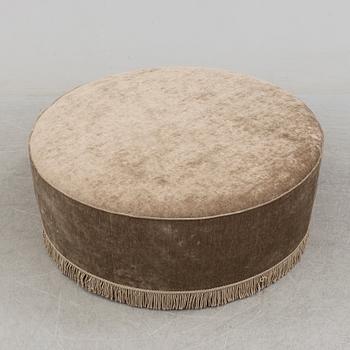 A 21st century upholstered foot stool by Gubi.