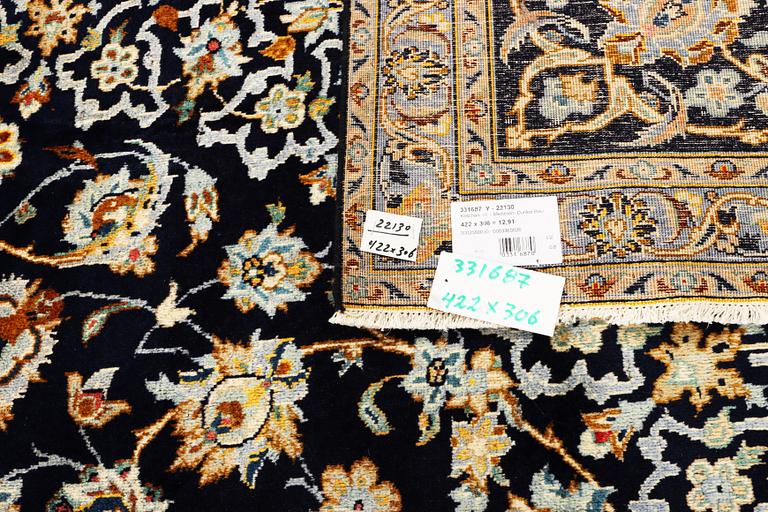 A Keshan carpet, c. 422 x 306 cm.