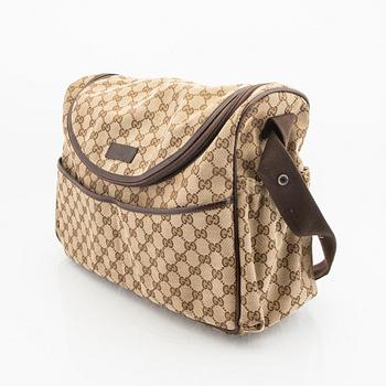 A Gucci diaper bag.