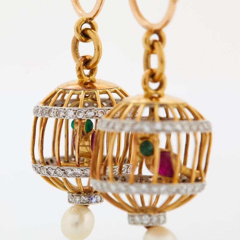 A pair of 18K gold birdcage earrings set with eight-cut diamonds, rubies and emeralds.