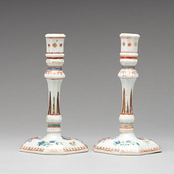 A pair of famille rose candle sticks, Qing dynasty, Qianlong (1736-95).