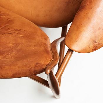 Finn Juhl, a teak and natural brown leather "Chieftain Chair" by Niels Vodder, 1950-60's.