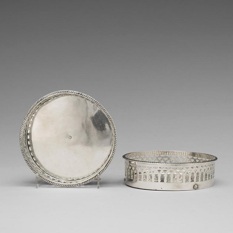 A matched pair of Swedish silver coasters, mark of Gustaf Folcker, Stockholm 1819 and 1826.