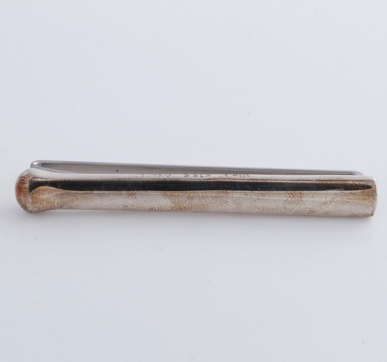 A tie clip by Ole Lynggaard.
