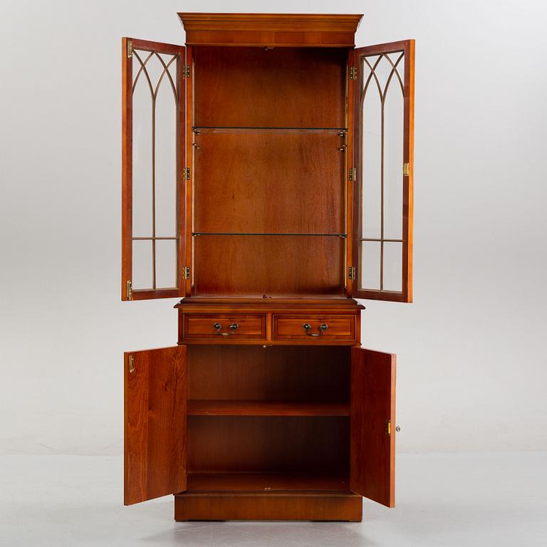 An English yew cabinet, 21st Century.