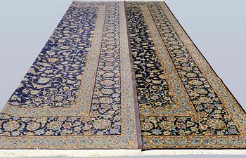 A Keshan carpet, signed, approx. 600 x 400 cm.