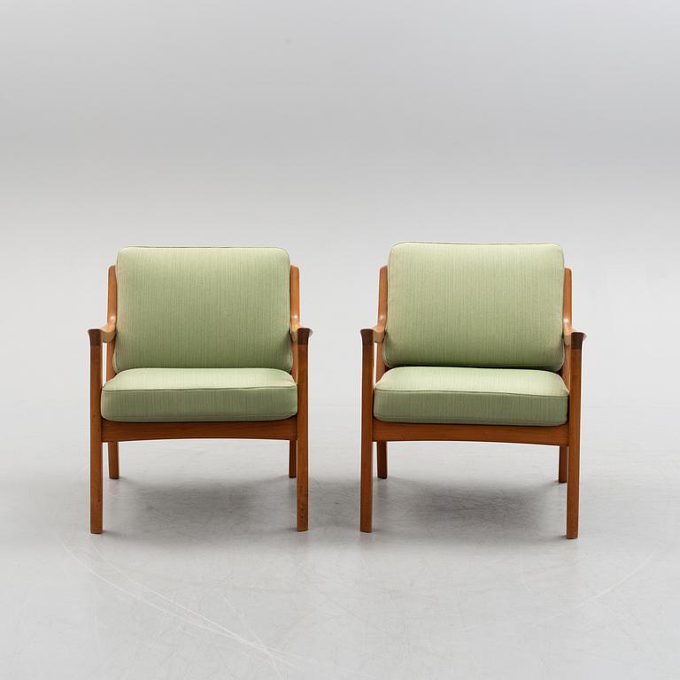 A pair of Ole Wanscher 'Senator' teak easy chairs, for France & Son, Denmark, second half of the 20th century.