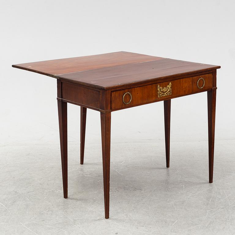 A mahogany-veneered Empire cards table, fist part of the 19th Century.