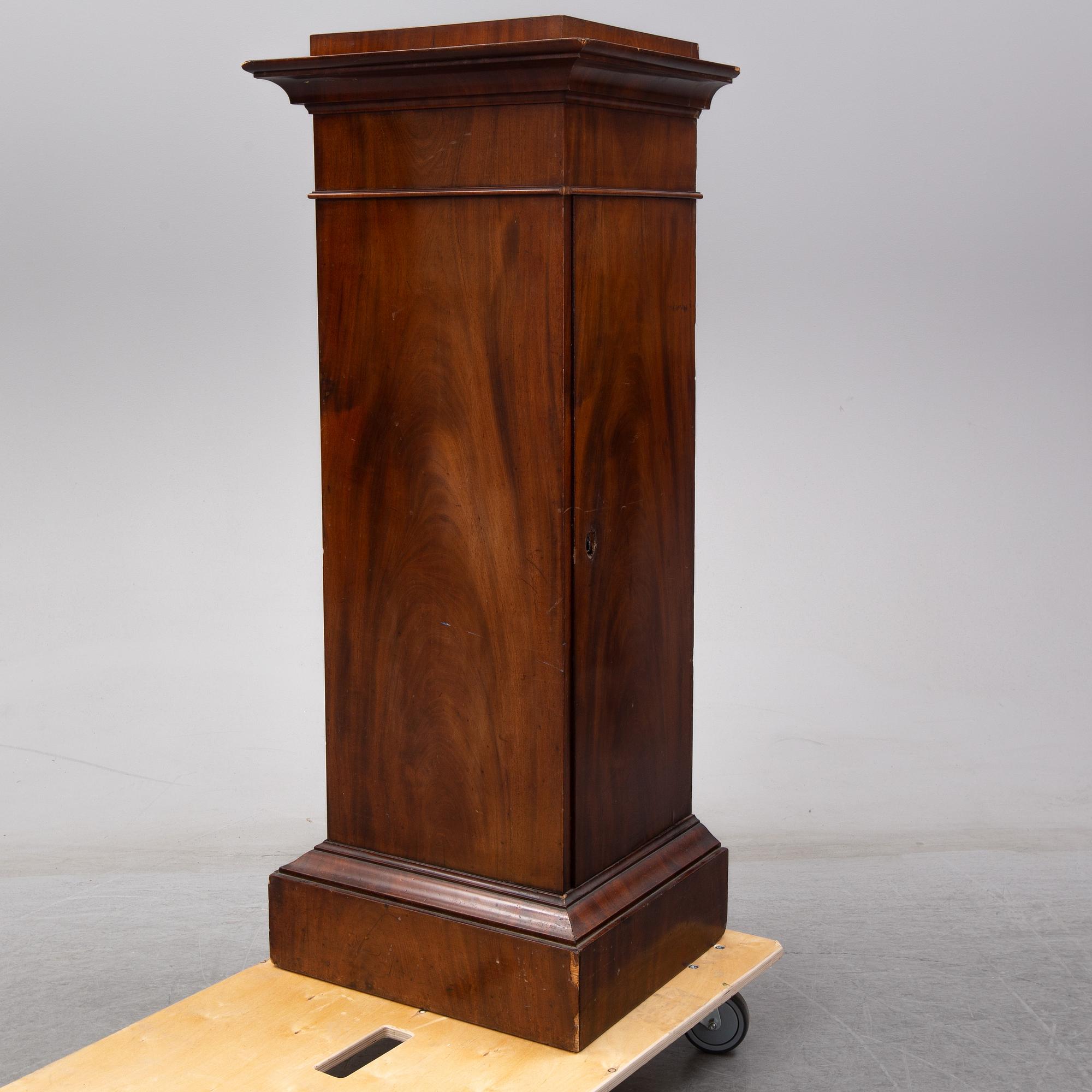 An early 19th Century empire mahogany cabinet.