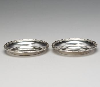 A matched pair of Swedish 19th century silver coasters, marked Mollenborg, Stockholm 1894 and 1900.