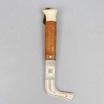 Oskar Tjäder, A reindeer horn knife, signed.