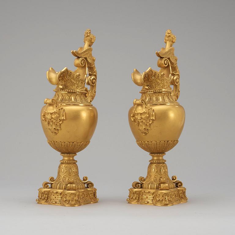 A pair of mid 19th century gilt bronze ornamental ewers.