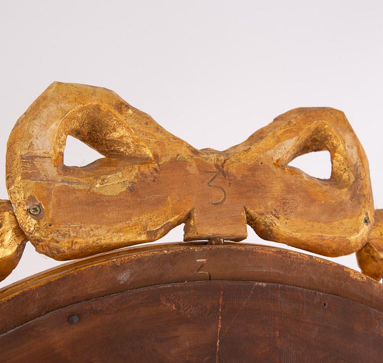 A gustavian style mirror by Erland Tidblad and gilded by Åke Sandelius i the second half of the 20th century.