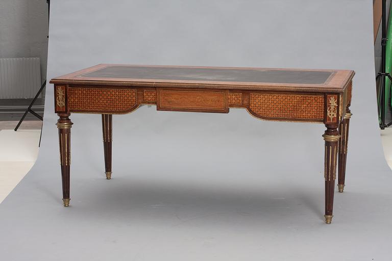A Louis XVI-style mahogny writing desk.