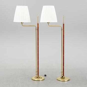 A pair of brass and leather floor lamps, Örsjö Designe, 21st century.