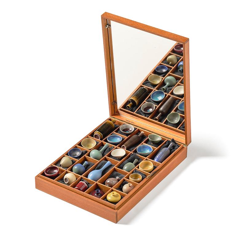 Berndt Friberg, a mahogany casket with stoneware miniatures, Gustavsberg Studio, no. 17.