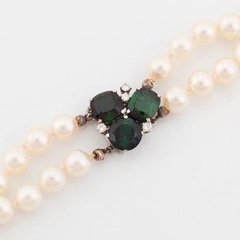 Cultured pearl necklace, clasp Torndals 18K white gold with green tourmalines and brilliant cut diamonds.