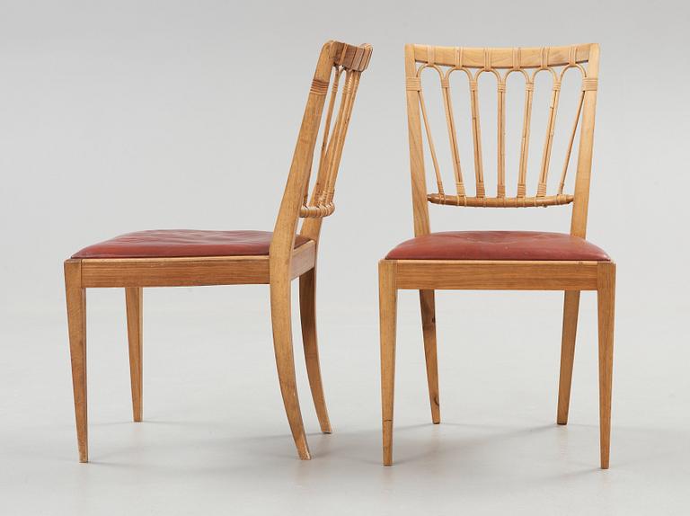 A pair of Josef Frank walnut and rattan chairs, Svenskt Tenn, model 1165.