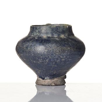A blue-glazed Nishapur pottery Jug, Persia, 13th century.