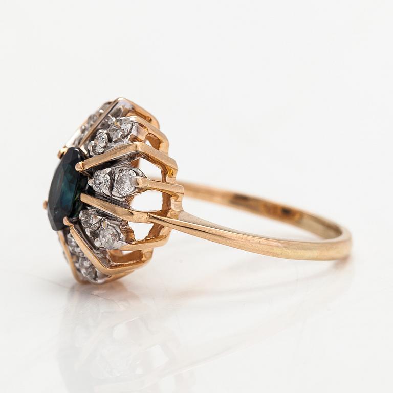 A 14K gold ring with diamonds ca. 0.40 ct in total and a sapphire. Finland 1995.