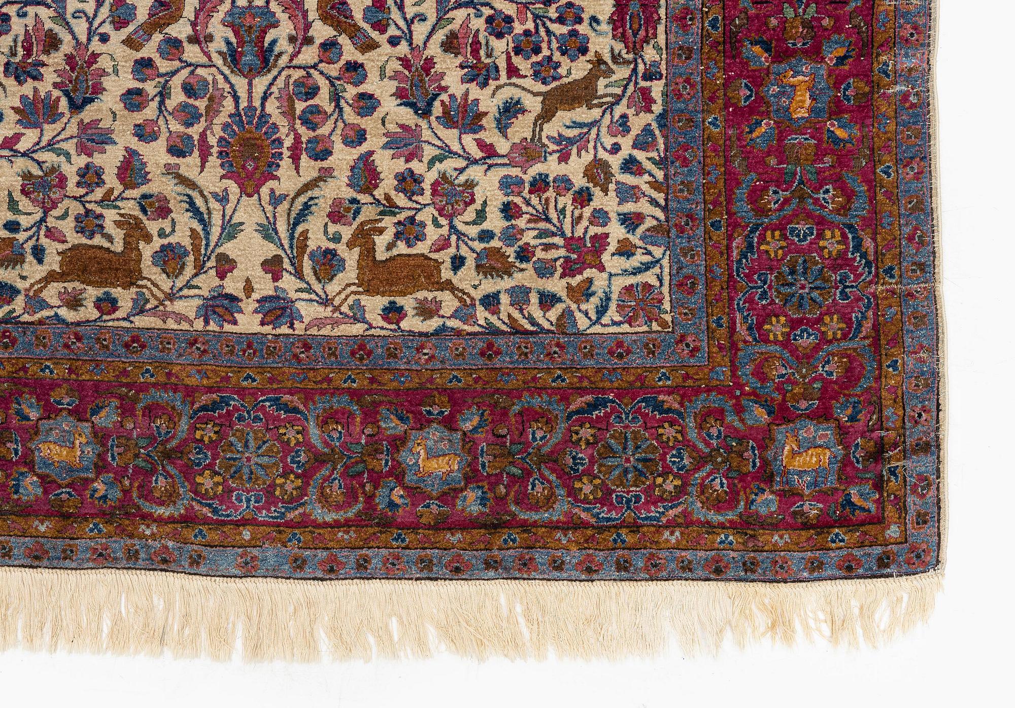 An antique pictoral silk Kashan, c. 205 x 128 cm.