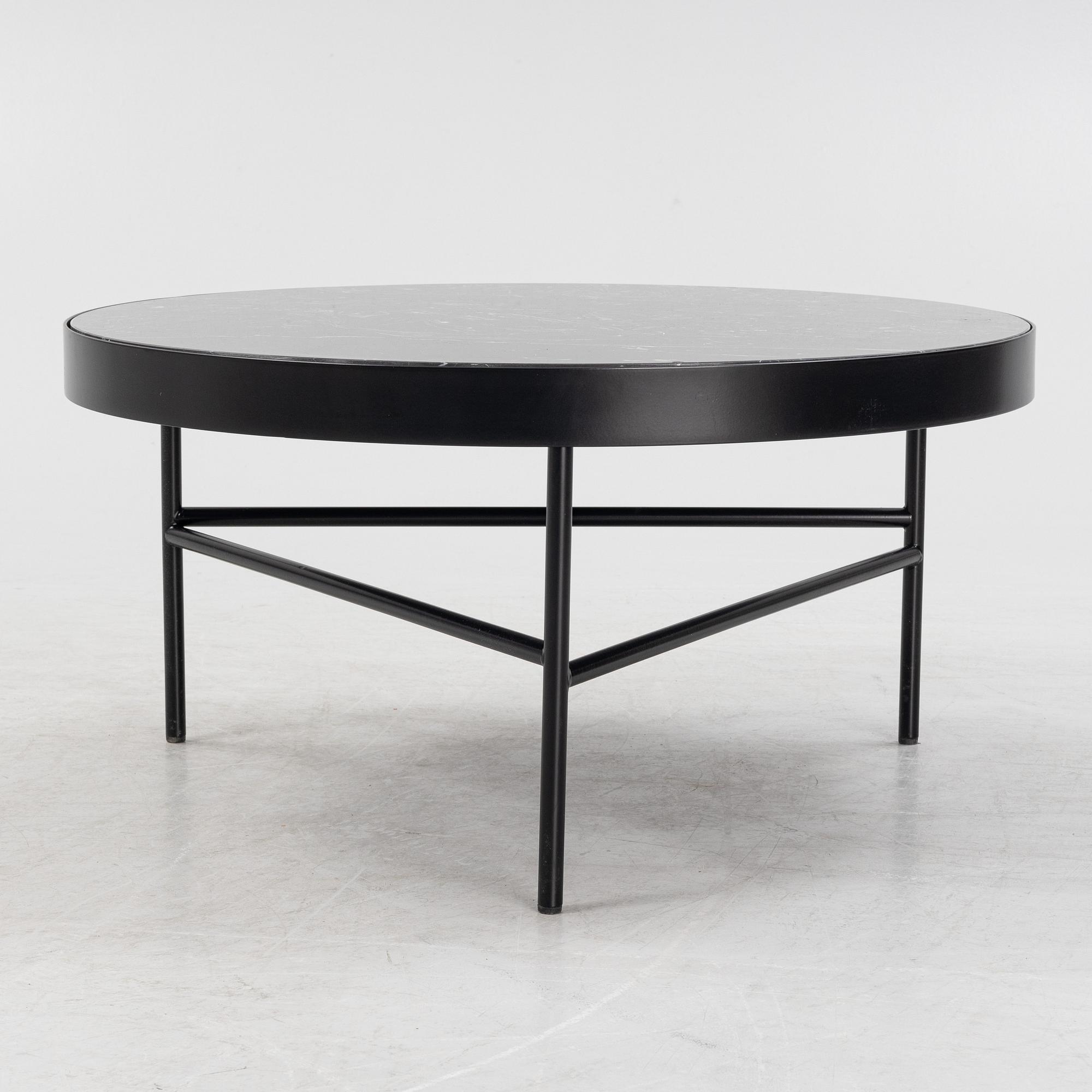 A marble top coffe table by Ferm Living, Denmark.