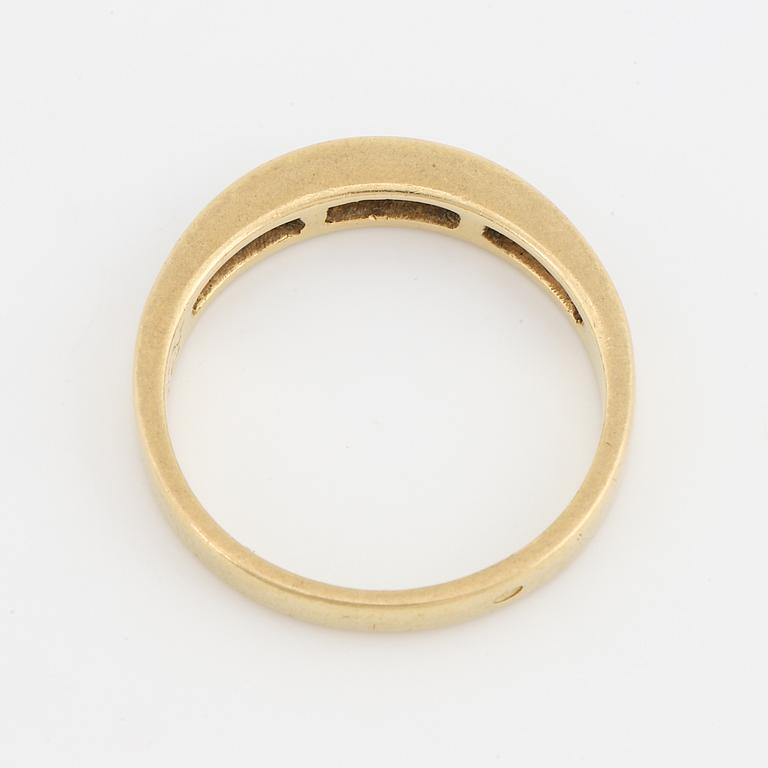 Step-cut diamond ring.