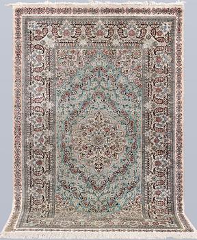 An Oriental silk rug, approx. 154 x 91 cm.