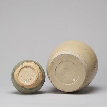 A celadon glazed jar with cover and a vase, South East Asia, 16/17th Century.