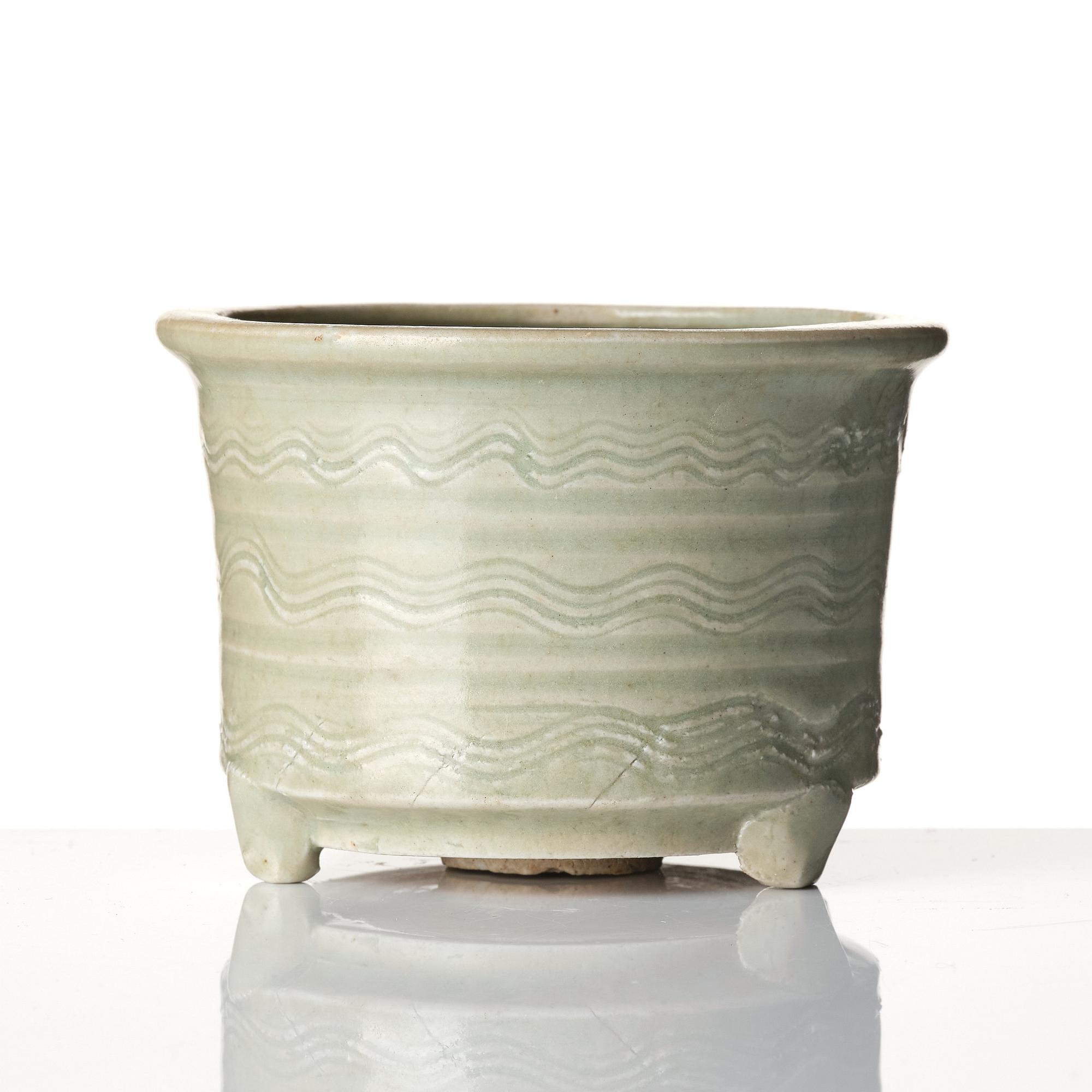 A celadon tripod censer, 16/17th century.