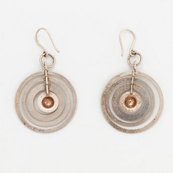 A pair of silver Tapio Wirkkala earrings.