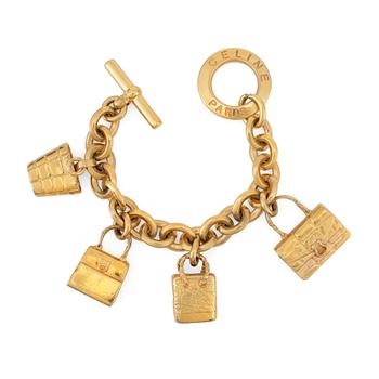 319. CÈLINE, a gold colored bracelet with pendants.