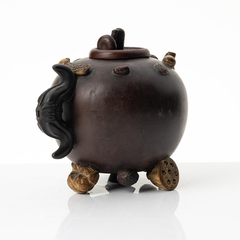 A Chinese 'hundred-fruit' yixing teapot, Qing dynasty (1644-1912).
