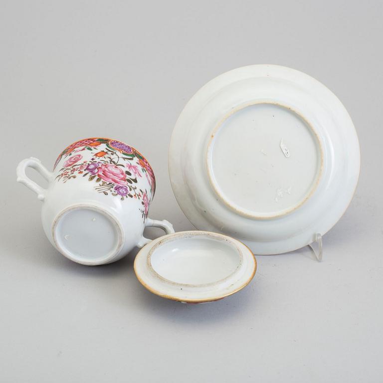 A pair of famille rose cups with covers and stands, Qing dynasty, Qianlong (1736-95).