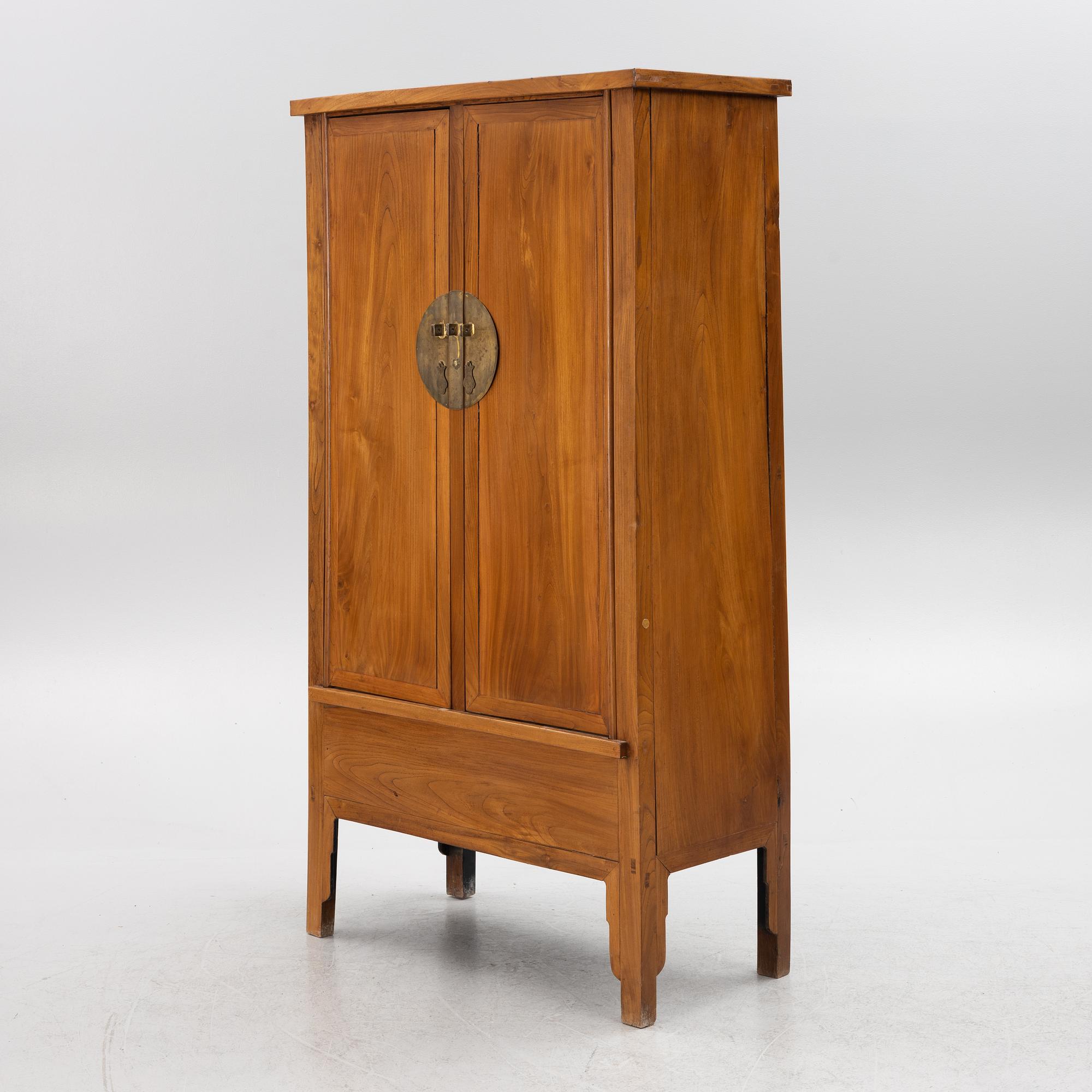 A Chinese hardwood cabinet, 20th century.