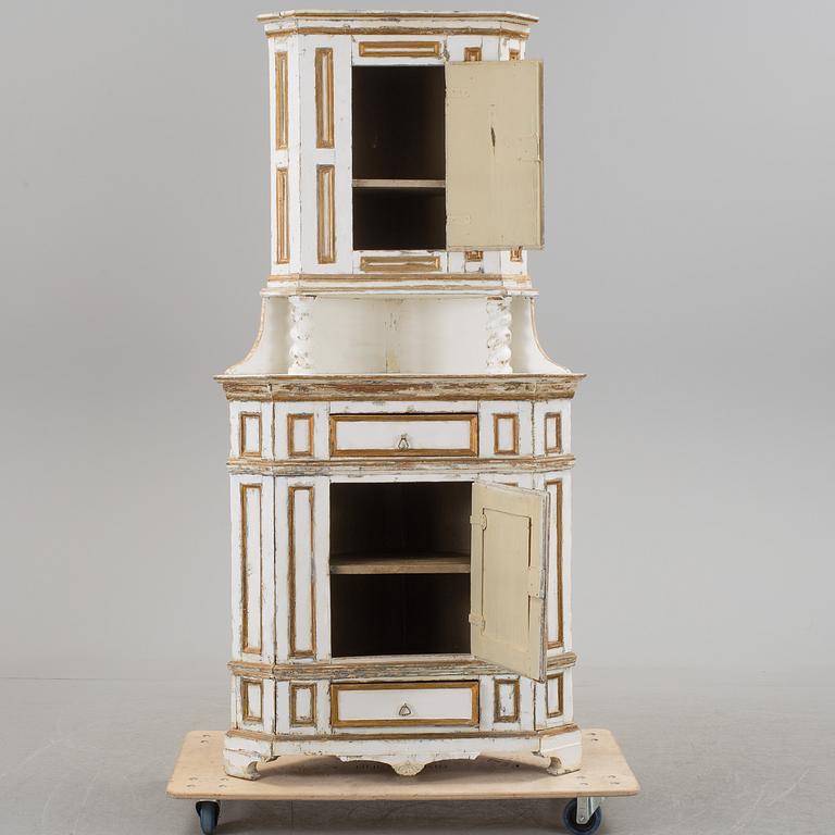 A Baroque style corner cabinet, 19th Century.