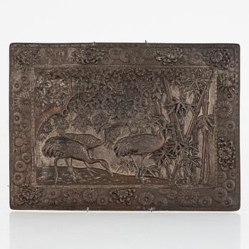 A Chinese copper relief, 20th century.