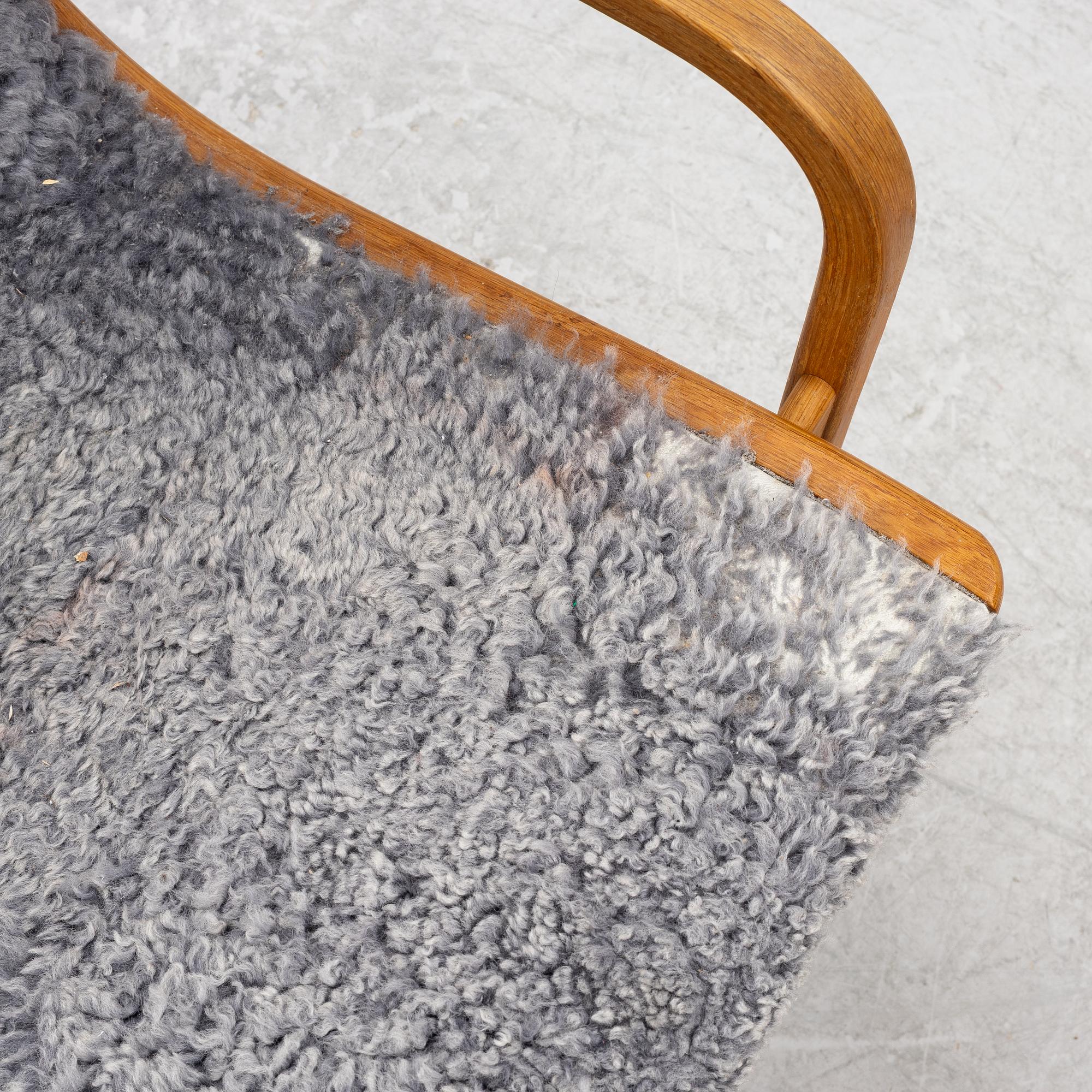 Yngve Ekström, a 'Lamino' armchair with ottoman, Swedese, Sweden, 2020's.