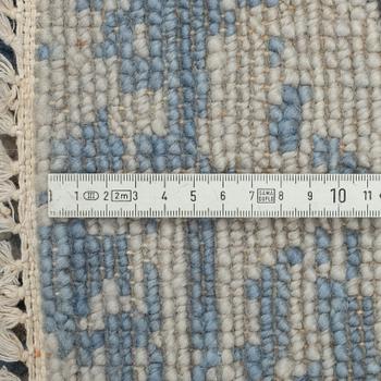 A carpet, oriental, ca 305 x 246 cm.