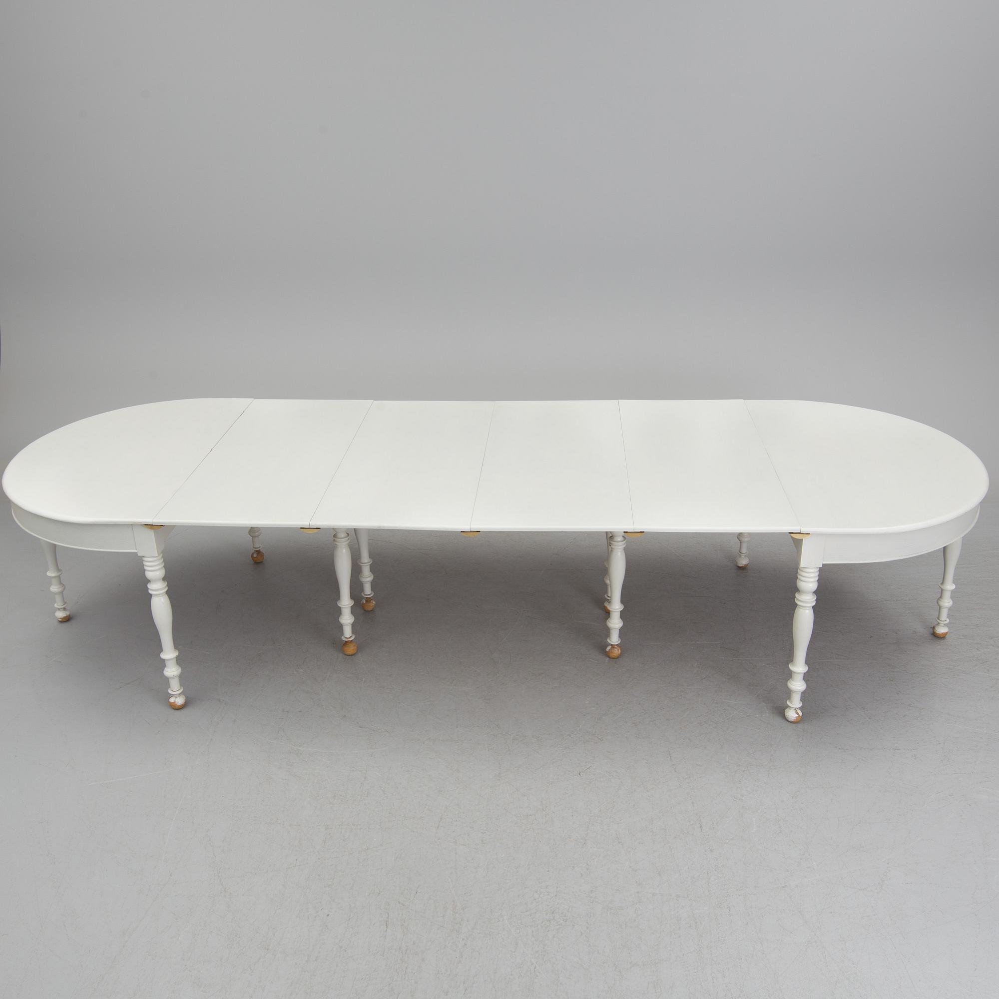A mid 19th century dining table with six extension leaves.