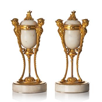 A pair of Louis XVI Cassolettes, white marble and gilt-bronze, around 1790.