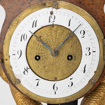 An Empire mantle clock, 19th Century.