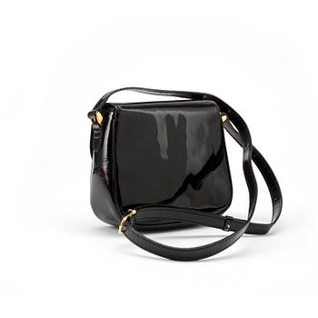 CÉLINE, a black leather patent shoulder bag.